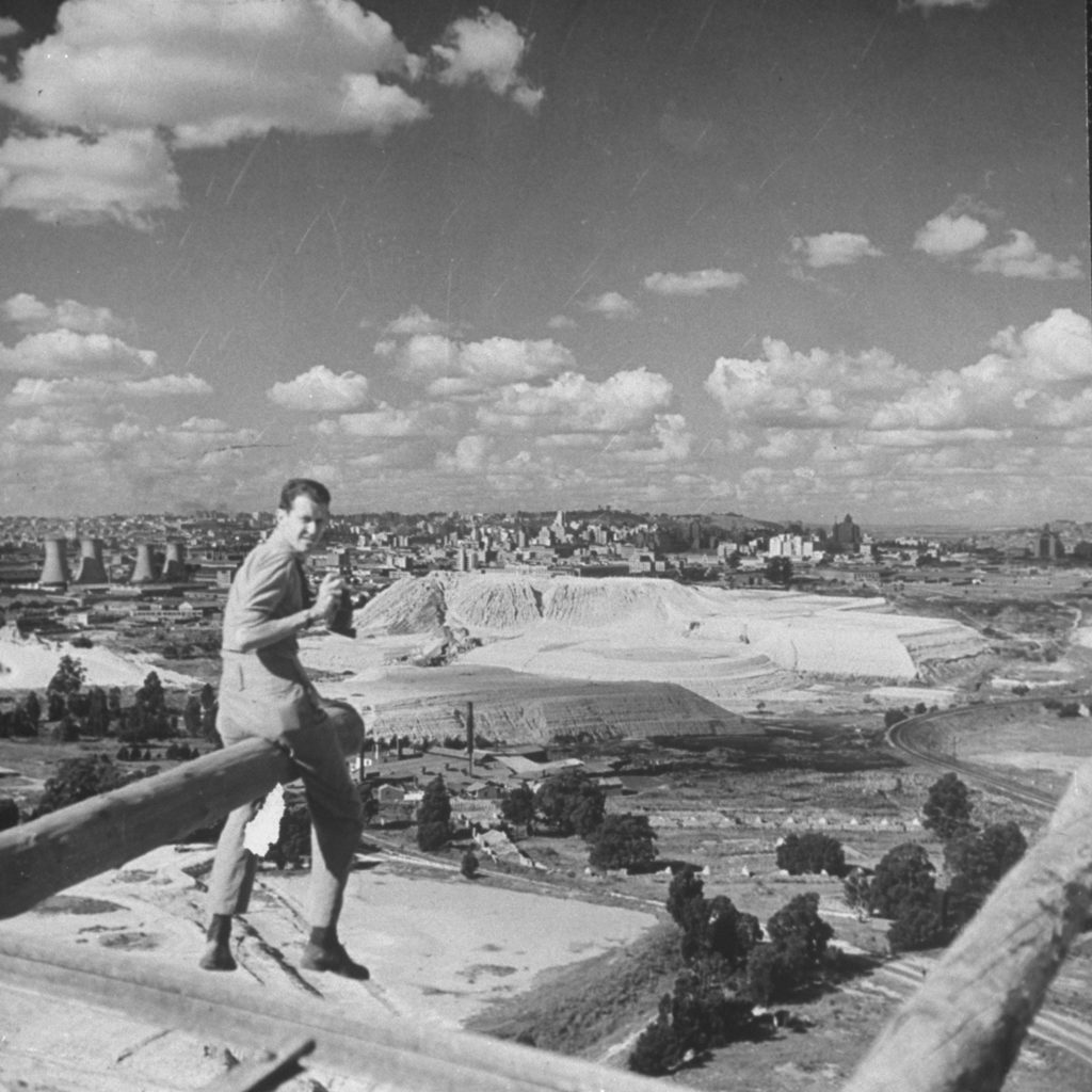 Preston Hart sitting on a cannon overlooking the city of Johannesburg, South Africa. (Photo by Hart Preston/The LIFE Picture Collection © Meredith Corporation)