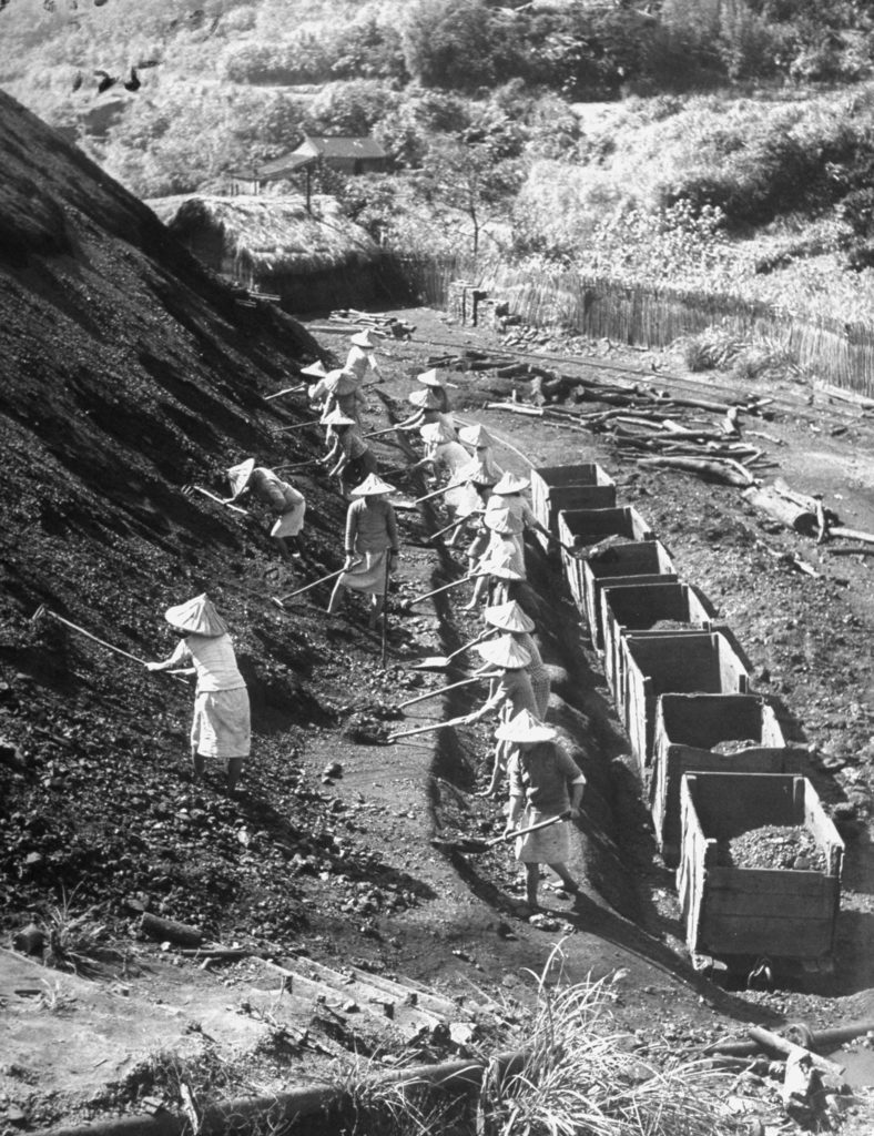 Women transferring coal from a hillside to mine cars in Taipeh, China. (Photo by Jack Birns/The LIFE Picture Collection © Meredith Corporation)