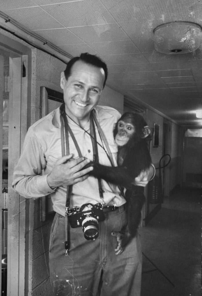 Portrait of Ralph Crane with his camera and a trained space chimpanzee. (Photo by Ralph Crane/The LIFE Picture Collection © Meredith Corporation)