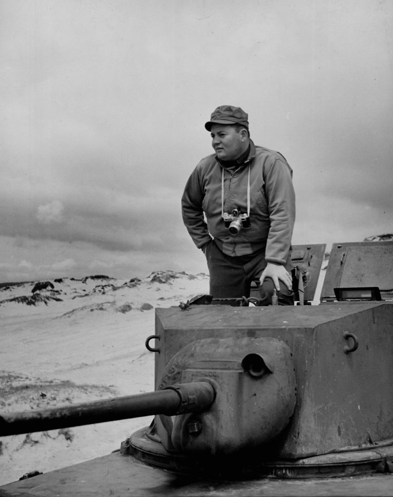 Photographer John Florea standing in open hatch of a tank. (Photo by John Florea/The LIFE Picture Collection © Meredith Corporation)