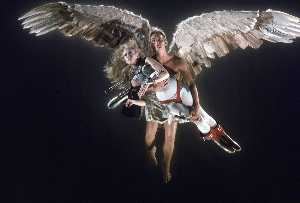 Actress Jane Fonda, wearing a space-age costume and holding a space gun, being carried by Guardian Angel (John Phillip) in a scene from Roger Vadim's motion picture Barbarella. (Photo by Carlo Bavagnoli/The LIFE Picture Collection © Meredith Corporation)