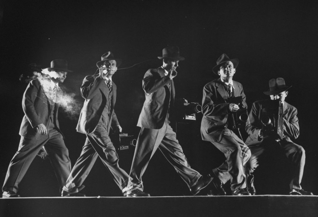 Multiple exposure photograph of LIFE photographer Frank Scherschel smoking & handling a camera, running & crouching as he would do on assignment. (Photo by Gjon Mili/The LIFE Picture Collection © Meredith Corporation)