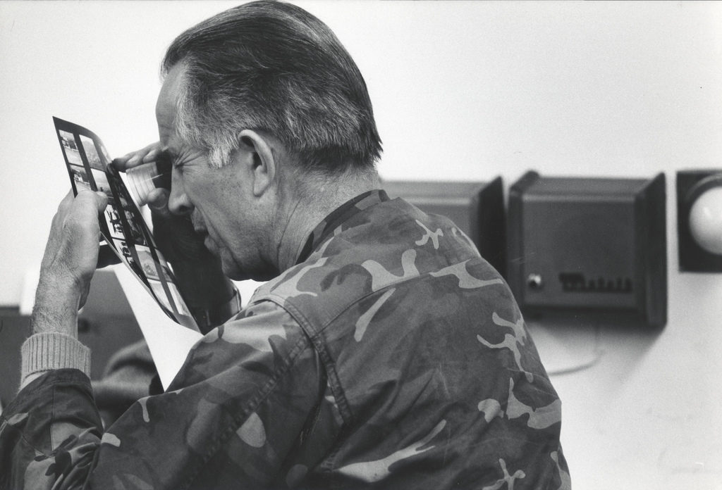David Douglas Duncan reviewing a contact sheet from one of his assignments from the Korean War. (Photo by Gjon Milil /The LIFE Picture Collection © Meredith Corporation)