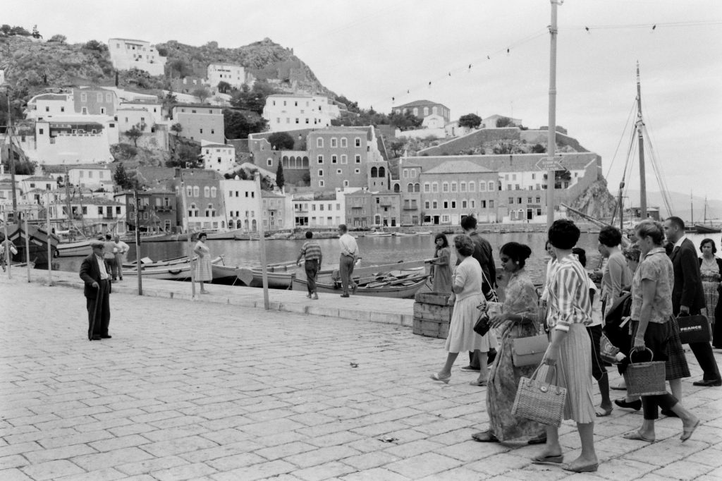 People walking along the shore of Hydra, Greece. (Photo by James Burke/The LIFE Picture Collection © Meredith Corporation)