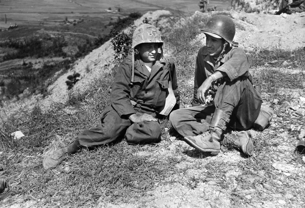 Photographers Carl Mydans (L) and David Douglas Duncan (R) relaxing during a lull in the Korean war. (Photo by Carl Mydans /The LIFE Images Collection)