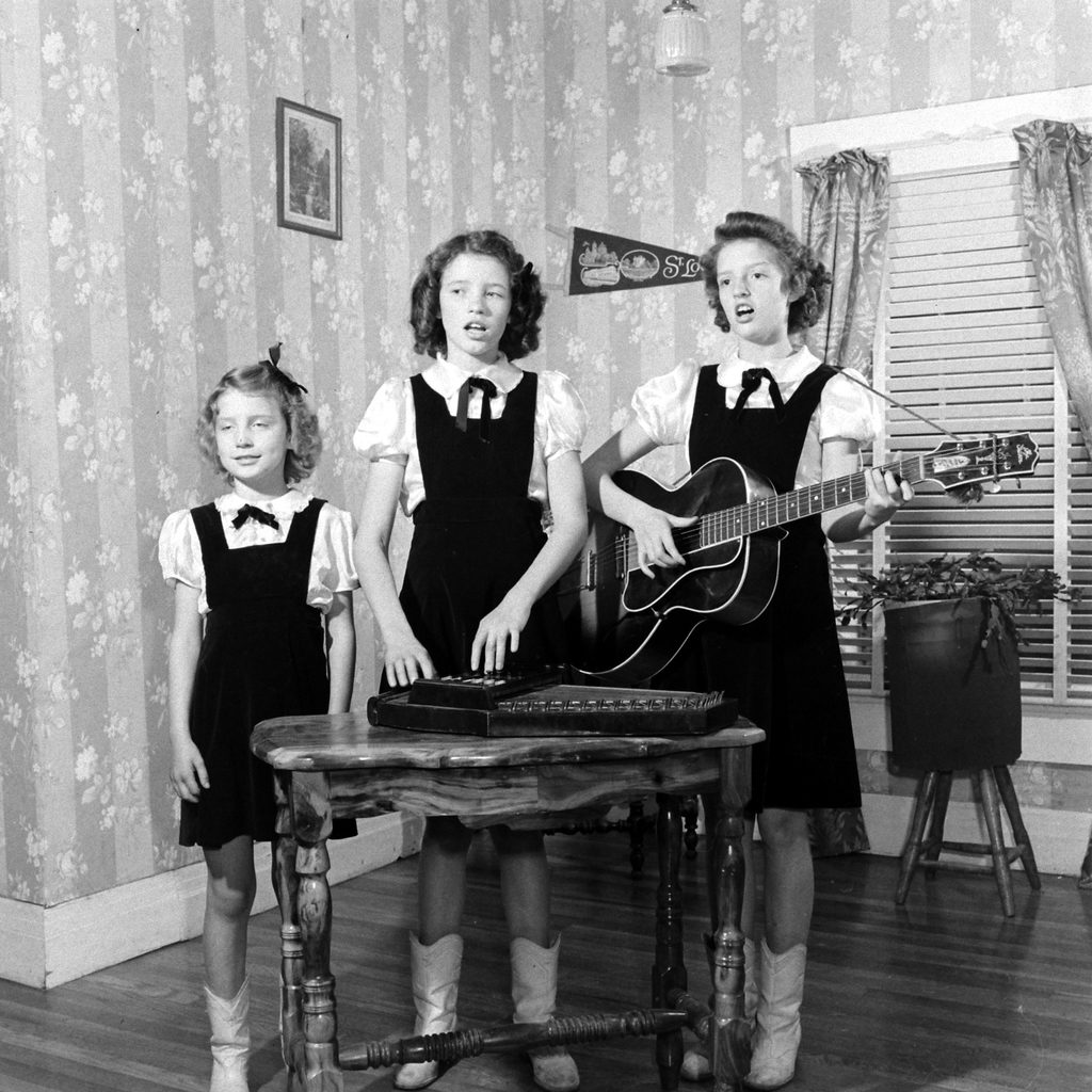 Sisters playing music together. (Photo by Eric Schaal/The LIFE Picture Collection © Meredith Corporation)