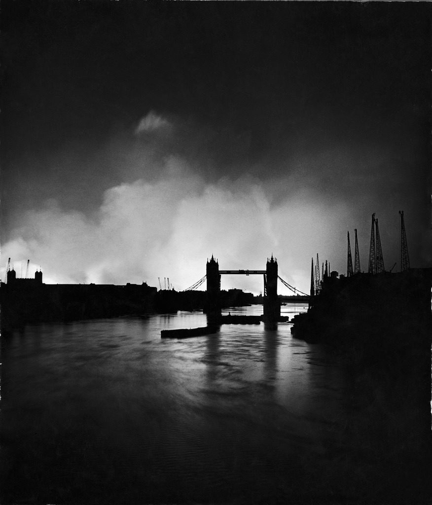"False sunset" during the Blitz, with Tower Bridge silhouetted against burning docks, London, 1940. (Photo by William Vandivert/The LIFE Picture Collection © Meredith Corporation)