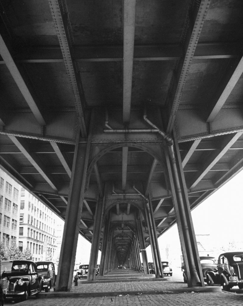 Under the elevated tracks, Broadway at Lynch, Brooklyn, 1946.