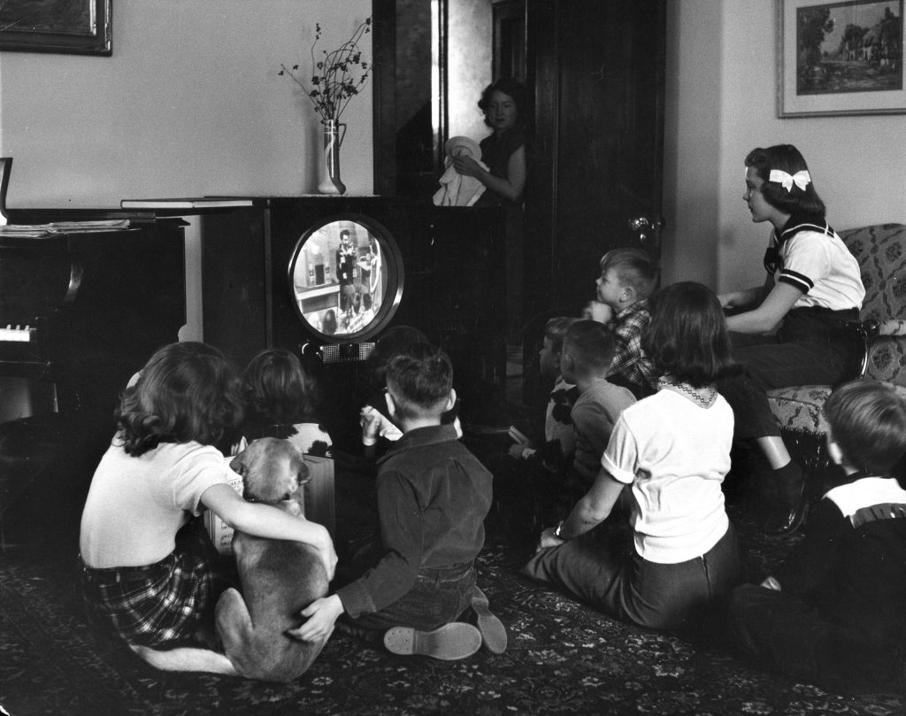 Grade school kids in Minneapolis watch a video "classroom lesson" on TV while the city's public schools are on strike in 1951.