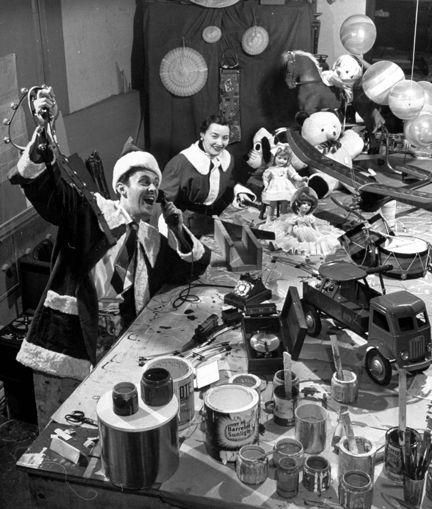"Santa and Mrs. Claus" answering telephone calls in their workshop at F. A. O. Schwartz, 1947.