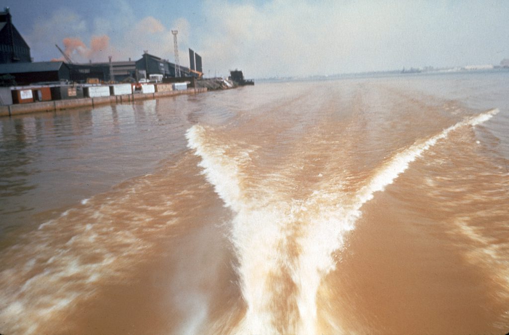 Color photos of pollution in the Great Lakes in 1968.