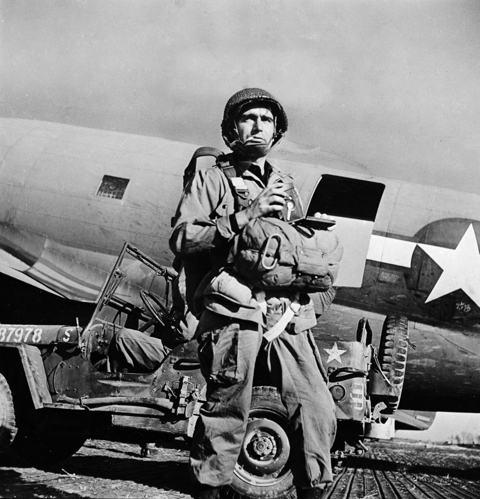 Robert Capa wearing parachute and gear prior to jumping in with troops during WWII. (Photo by Robert Capa/The LIFE Picture Collection © Meredith Corporation)