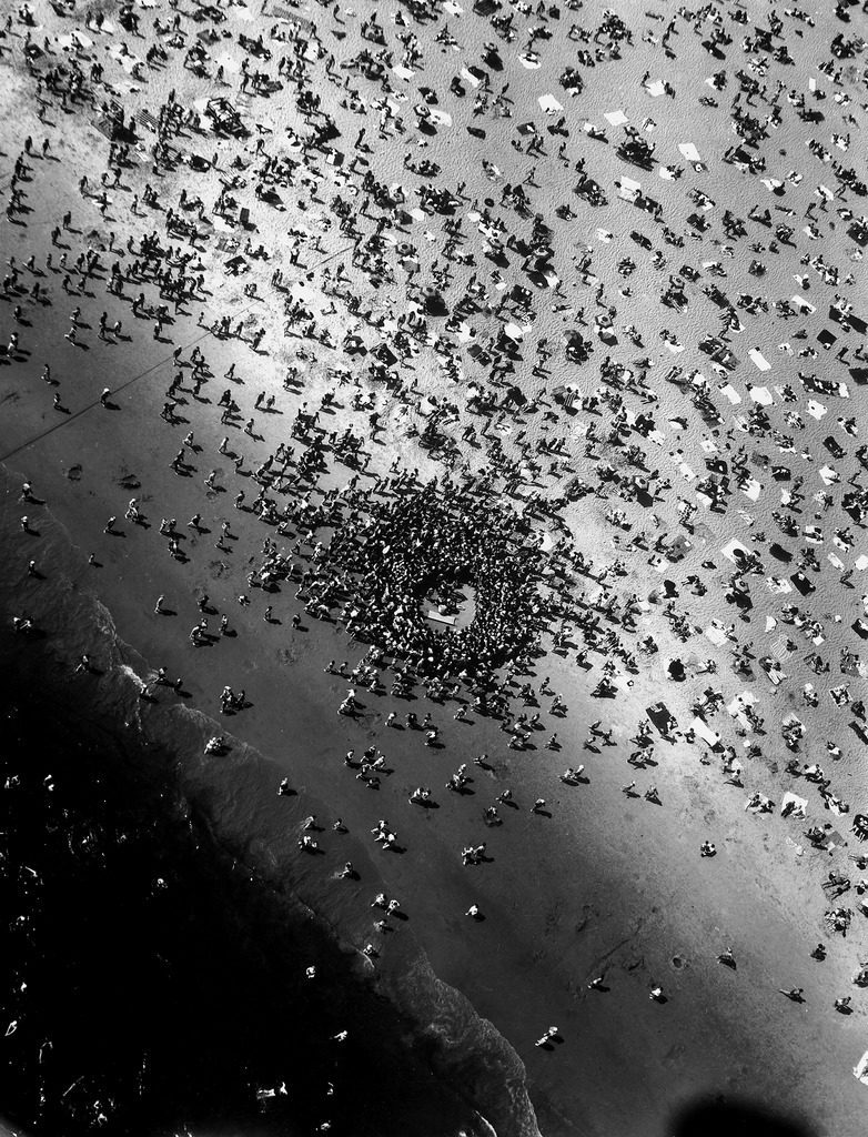 Birdseye view of near drowning victim Mary Eschner, who is reviving in the center of the crowd, at Coney Island. (Photo by Margaret Bourke-White/The LIFE Picture Collection © Meredith Corporation)