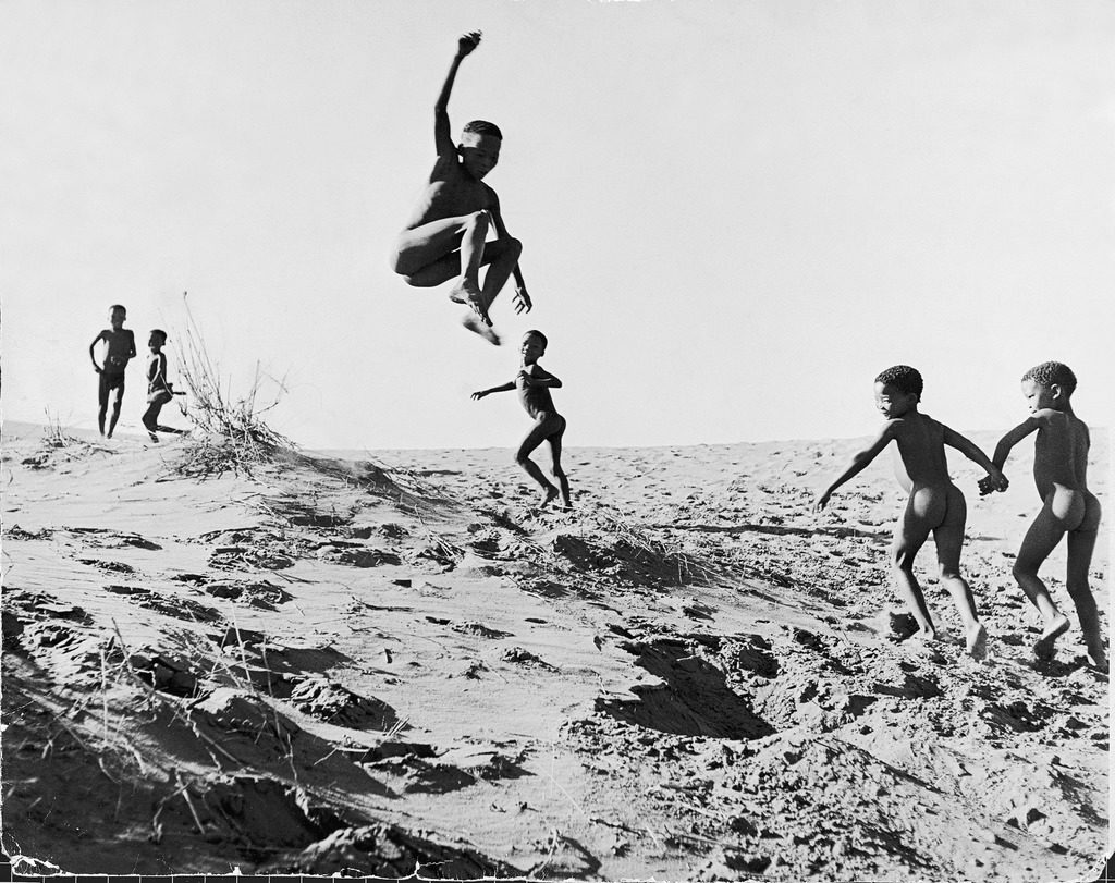 Bushman children playing games on sand dunes.(Photo by N.R. Farbman/The LIFE Picture Collection © Meredith Corporation)