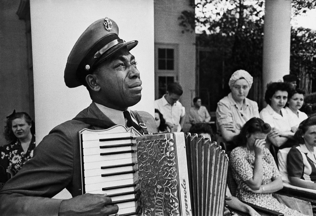 Navy CPO Graham Jackson crying as he plays 'Goin' Home' on the accordion at President Franklin D. Roosevelt's funeral. (Photo by Edward Clark/The LIFE Picture Collection © Meredith Corporation)