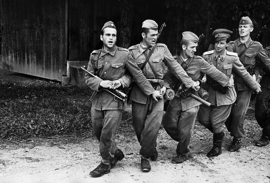 Yugoslavian infantrymen and an officer dancing the conga-like Kolo while singing. (Photo by John Phillips/The LIFE Picture Collection © Meredith Corporation)