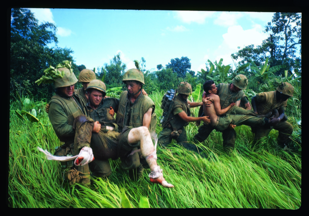 Members of 1st Marine Division carrying their wounded during the Vietnam War, 1966. (Photo by Larry Burrows/The LIFE Picture Collection © Meredith Corporation)