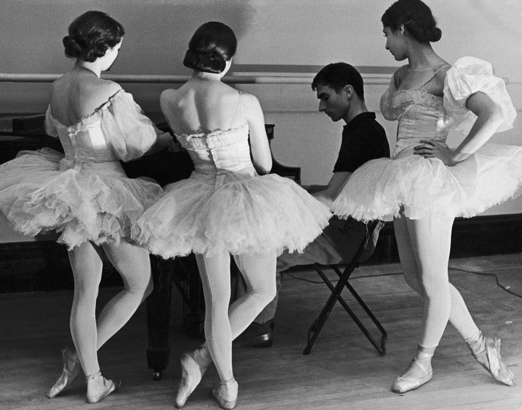 Ballerinas at George Balanchine's American School of Ballet gathered around accompanist during rehearsal. (Photo by Alfred Eisenstaedt/The LIFE Picture Collection © Meredith Corporation)