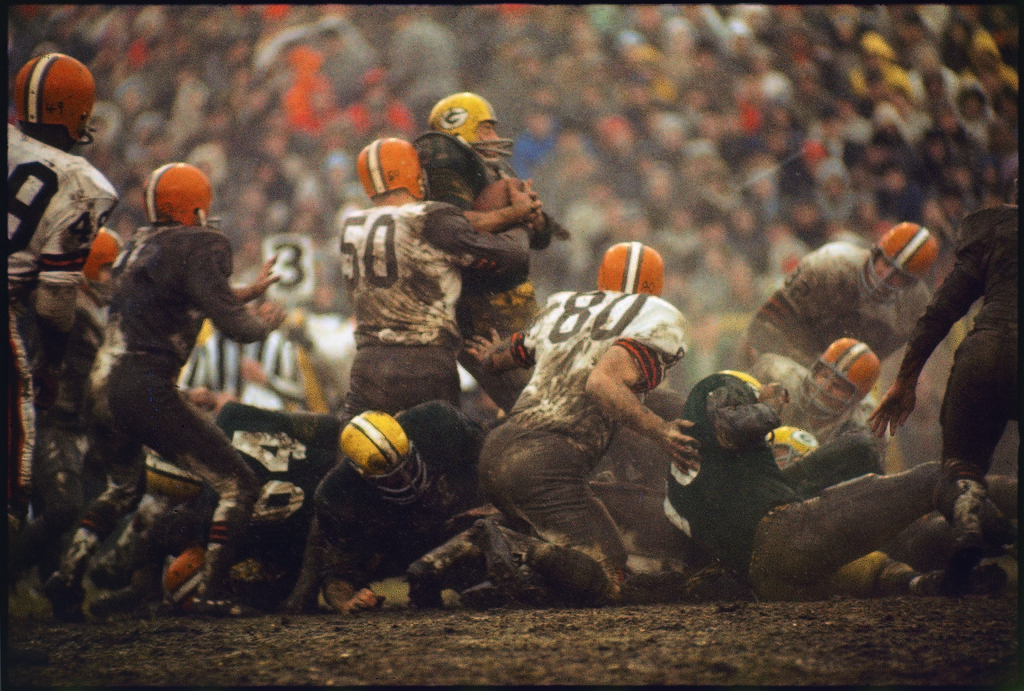 Cleveland Browns Vince Costello (#50) wrapping a tackle around Green Bay Packers running back Jim Taylor. (Photo by Arthur Rickerby/The LIFE Picture Collection © Meredith Corporation)