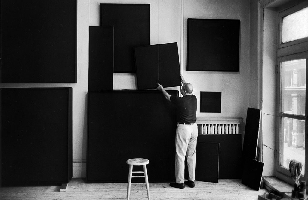 American artist Ad Reinhardt hangs his paintings to dry in a studio, New York, New York, 1966.(Photo by Michael Mauney/The LIFE Picture Collection © Meredith Corporation)
