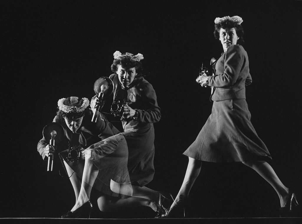 Multiple exposure photograph of LIFE photographer Marie Hansen handling a camera, running &amp; crouching as she would do on assignment. (Photo by Gjon Mili/The LIFE Picture Collection © Meredith Corporation)