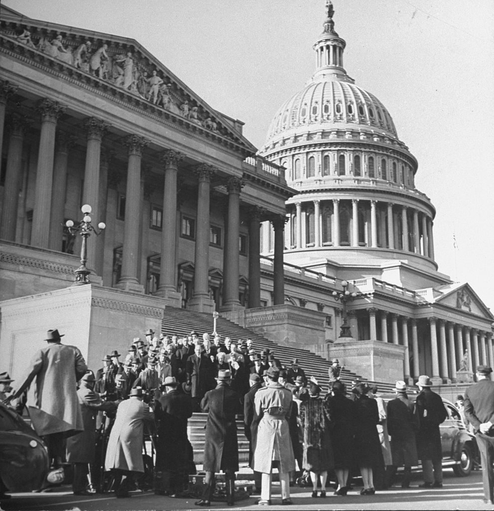 Congressmen posing on the front steps of the Capitol Building. (Photo by Marie Hansen/The LIFE Picture Collection © Meredith Corporation)