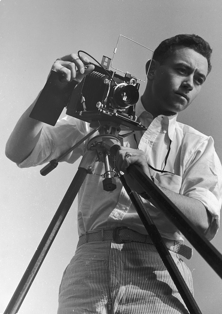 Photographer Rex Hardy Jr lines up a shot with his tripod -mounted camera, December 1937. (Photo by Alexander King/The LIFE Picture Collection © Meredith Corporation)