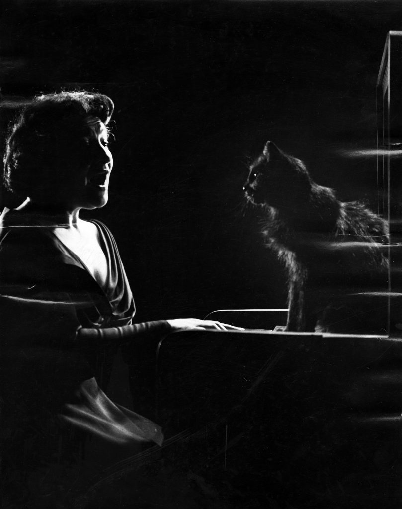 Russian-born American operatic mezzo-soprano Jennie Tourel sings as a cat named Blackie sits on a piano, 1952.