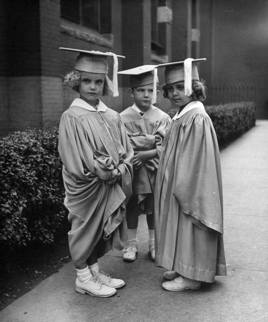 Three children graduating kindergarten in the U.S., 1945.