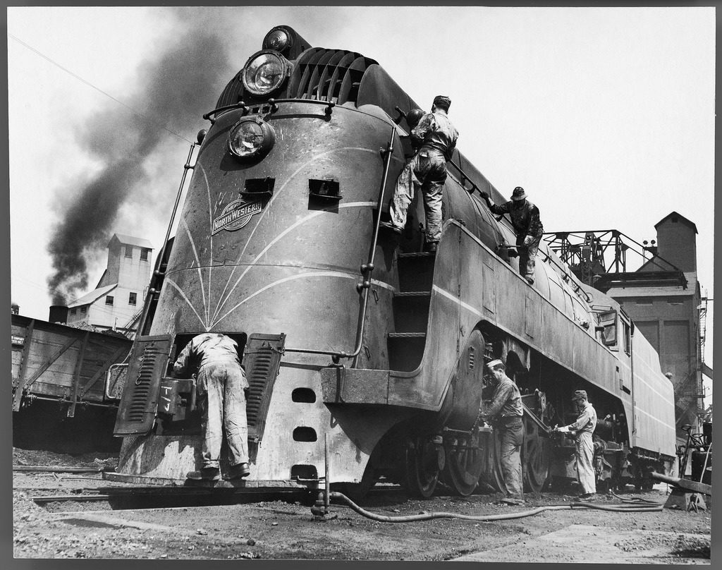 Soldiers working on a locomotive. (Photo by Myron Davis/The LIFE Picture Collection © Meredith Corporation)