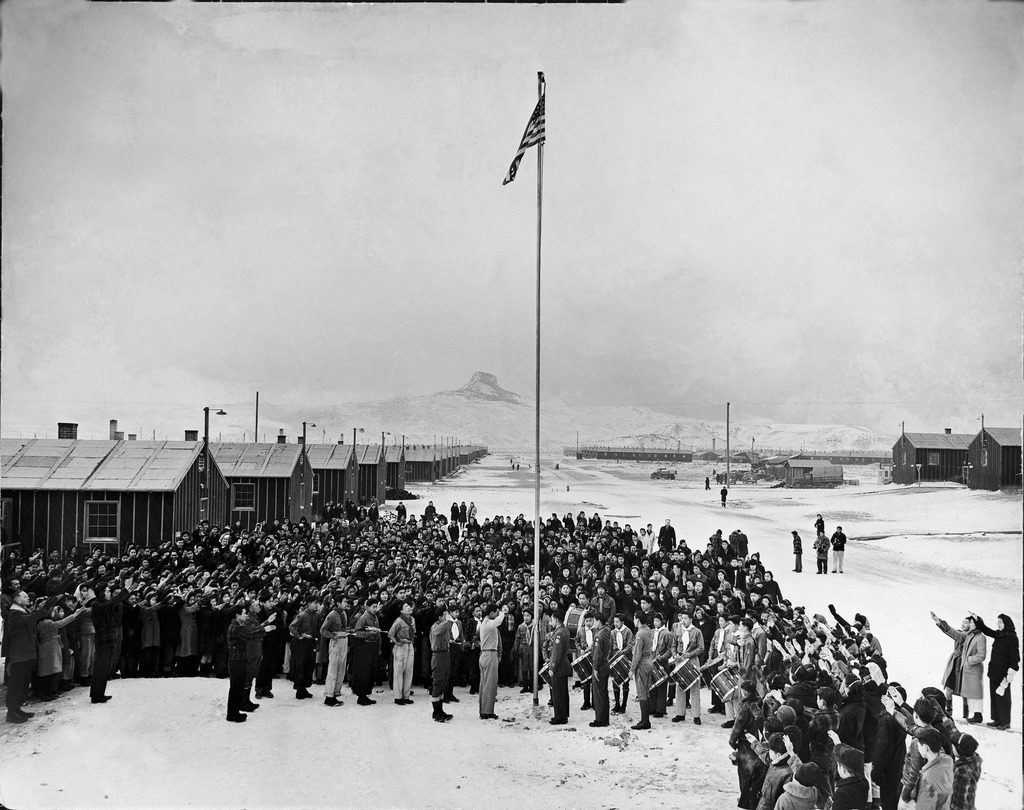 Nisei Japanese-Americans participating in a flag saluting ceremony at relocation center in forced internment during WWII. (Photo by Hansel Meith/The LIFE Picture Collection © Meredith Corporation)