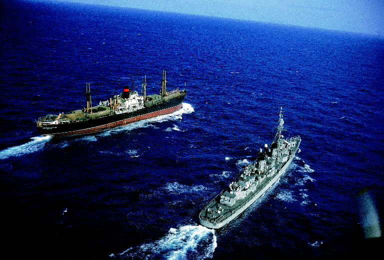 American destroyer USS Vesole escorting the Russian freighter Polzunov into international waters. The freighter is loaded with nuclear missiles and related equipment bound for the Soviet Union after being removed from Cuban soil, bringing an end to the Cuban Missile Crisis. (Photo by Carl Mydans/The LIFE Picture Collection © Meredith Corporation)