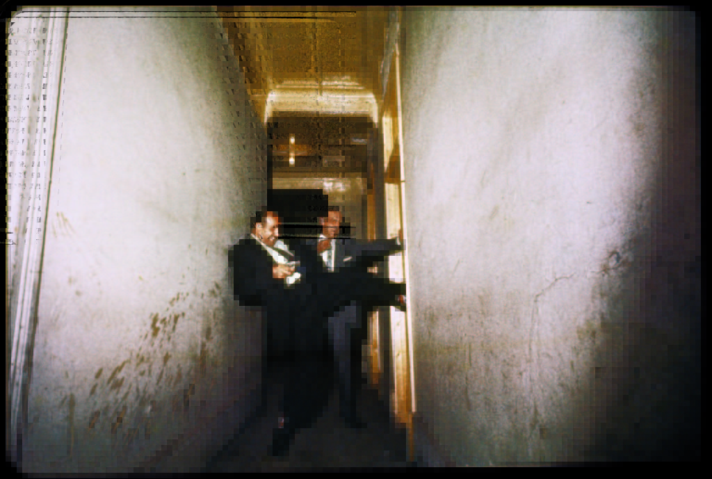 Detectives forcing their way into a suspicious room. (Photo by Gordon Parks/The LIFE Picture Collection © Meredith Corporation)