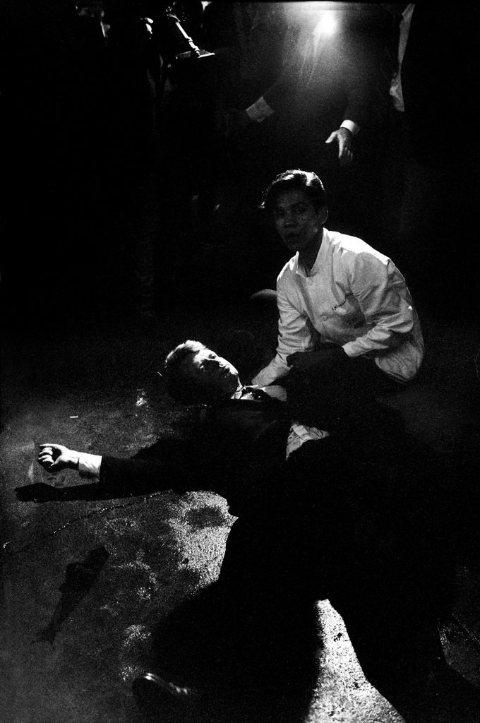 Senator Robert Kennedy sprawled semiconscious in his own blood on floor after being shot in the brain and neck by Sirhan Sirhan while a busboy Juan Romero tries to comfort him. (Photo by Bill Eppridge/The LIFE Picture Collection © Meredith Corporation)