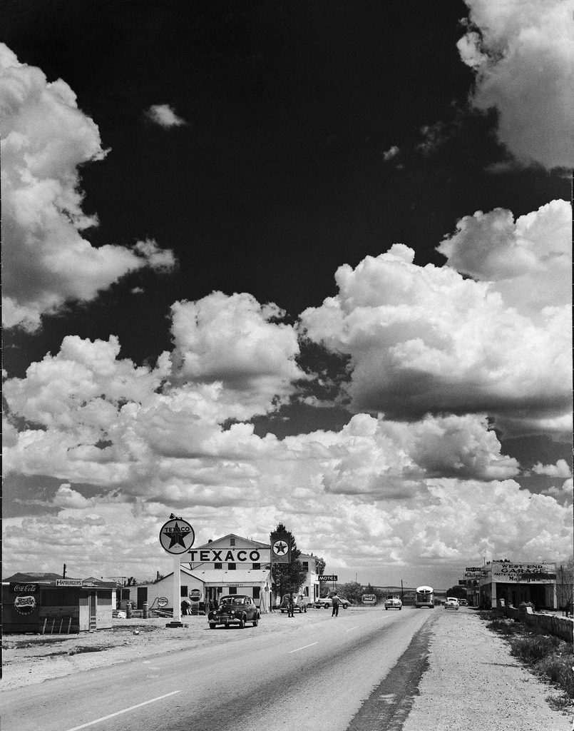 Dramatic cumulus clouds billowing over a Texaco gas station along a stretch of highway US 66, aka Route 6. (Photo by Andreas Feininger/The LIFE Picture Collection © Meredith Corporation)
