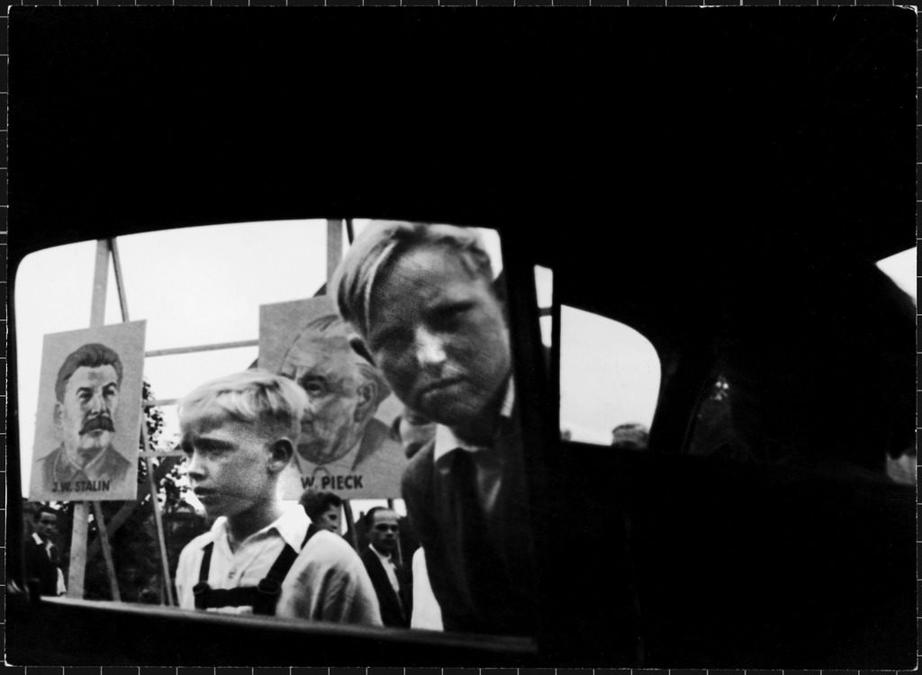 At the Leipzig Industrial Fair in East Germany, envious kids peer into a car and shout "From America! Look!" (Photo by Charles Steinheimer/The LIFE Picture Collection © Meredith Corporation)