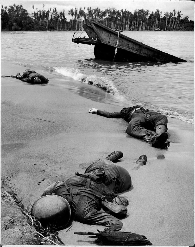 Three dead Americans, killed during the fight to take Buna Beach from the occupying Japanese forces, Papua New Guinea, 1943. (Photo by George Strock/The LIFE Picture Collection © Meredith Corporation)