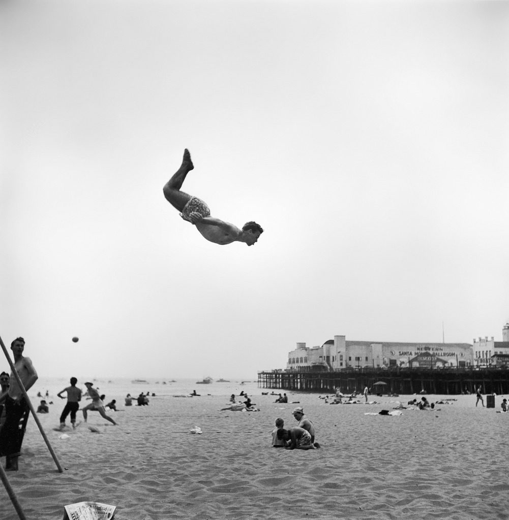 A man flying off a trampoline at Santa Monica Beach. (Photo by Loomis Dean/The LIFE Picture Collection © Meredith Corporation)