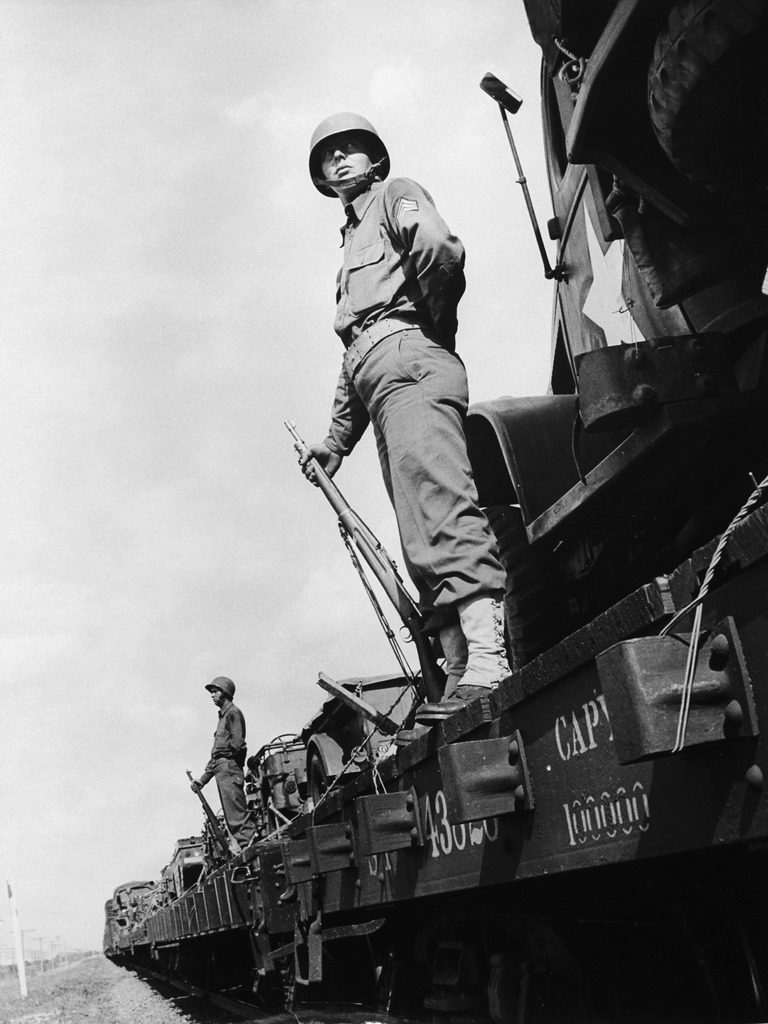 US soldiers standing guard on a troop train. (Photo by Myron Davis/The LIFE Picture Collection © Meredith Corporation)