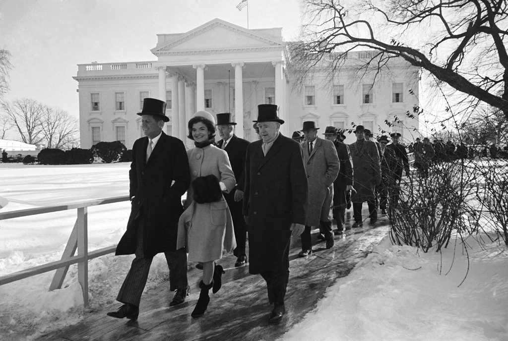 John and Jackie Kennedy walk to JFK's inauguration ceremony from the White House, January 1961.