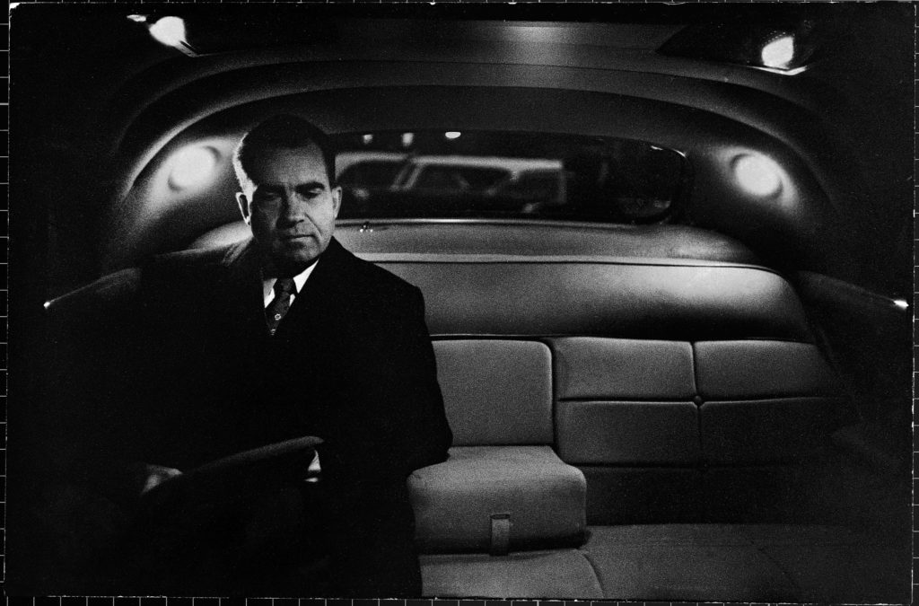Vice President Richard Nixon sitting in the back seat of a dimly lit limousine after a day taking over duties for President Eisenhower, during his hospitalization from a stroke. (Photo by Hank Walker/The LIFE Picture Collection © Meredith Corporation)